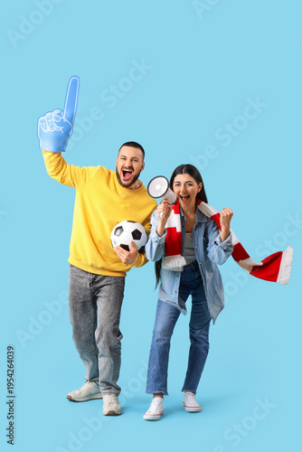 Soccer fans with ball shout...