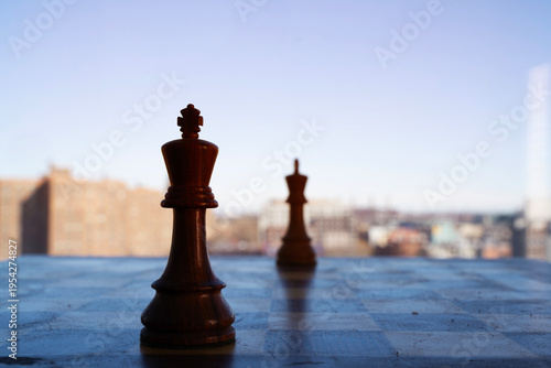Картината върху платно A conceptual minimalist photo focusing on a single wooden chess queen piece on a board