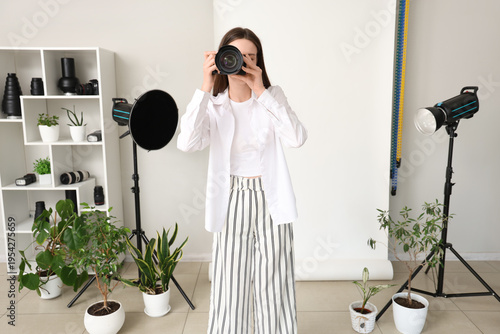 Female photographer with ca...