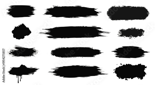 Abstract ink brush strokes in varying shapes and textures on textured paper, evoking a sense of artistic creativity and expressive potential.