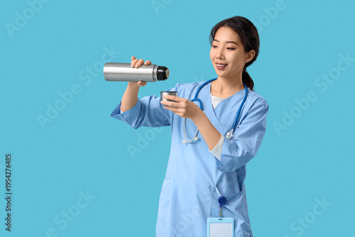 Female Asian doctor with th...