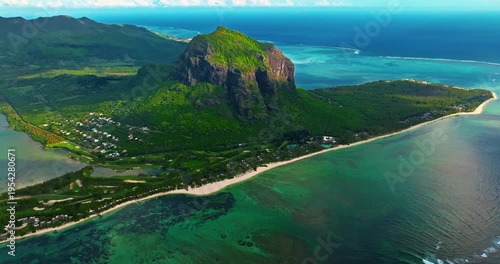 Aerial view of Le Morne Peninsula, Le Morne Brabant Mountain. Sea lagoon formed by coral reefs, Mauritius Island, Africa, Indian Ocean. Underwater waterfall in Le Morne