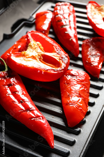 Grill with tasty peppers on...