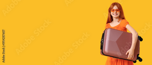 Cute girl holding suitcase ...