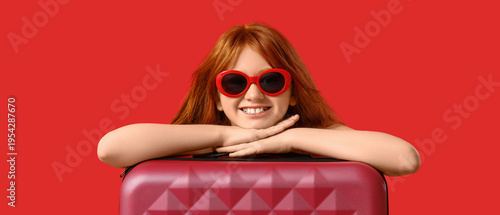Cute girl with suitcase on ...