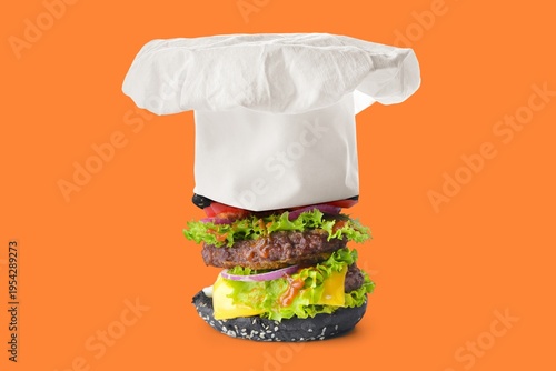 Cook hat and big burger on ...