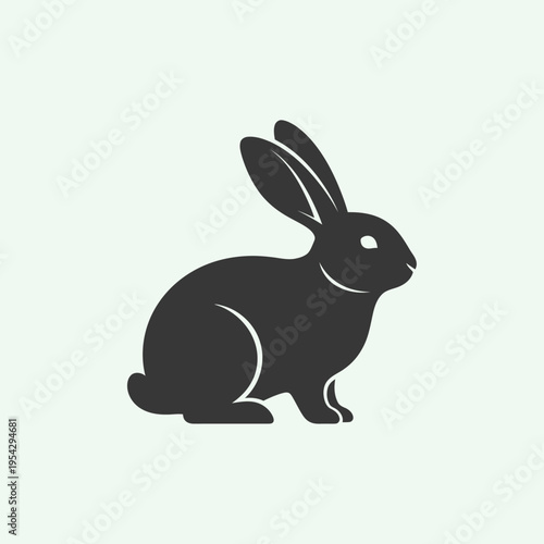 Simple Silhouette of a Cute Rabbit Sitting and Looking to the Side.