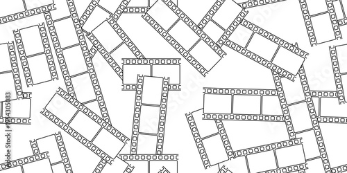 Seamless pattern with messy scattered black and white movie film strips on white background