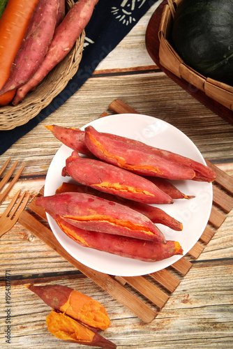 Fresh Baked Red Sweet Potatoes on Wooden Board - Healthy Organic Vegetables Studio Photography