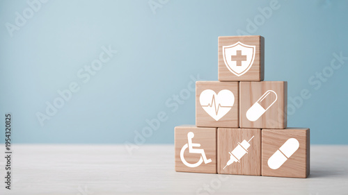 A pyramid of wooden blocks with medical symbols on a light blue background