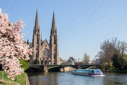 Boat passing by Saint-Paul Church Strasbourg in spring, Strasbourg