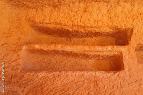 Interior of an ancient Nabataean burial chamber with loculi at Jabal AlBanat in Hegra, AlUla, Saudi Arabia