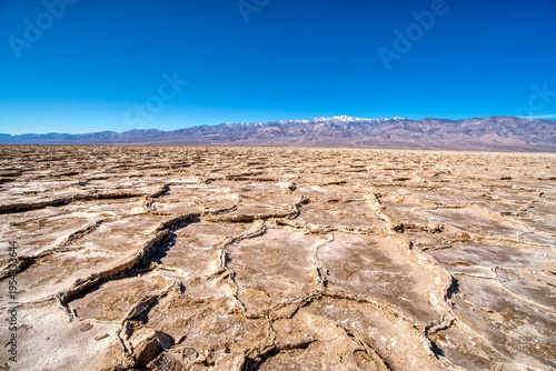 Desert floor cracks under blazing sun