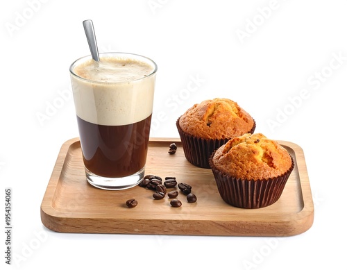 A wooden tray presents coffee, two muffins, and coffee beans on a white backdrop, creating a delicious snack scene