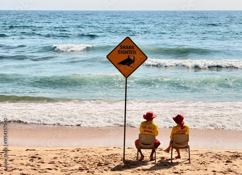 Surf Lifesavers Under Shark Warning Sign on Australian Beach