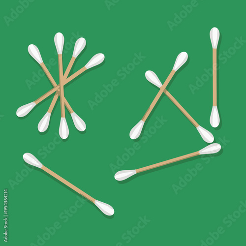 Cotton Swabs Arranged on Green Background.