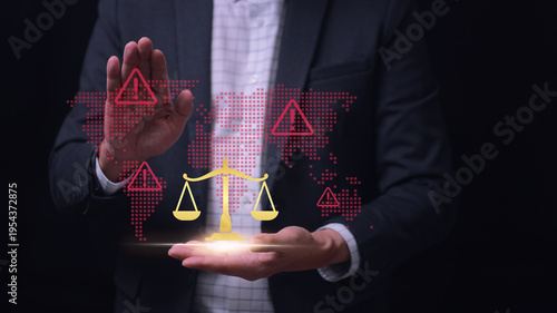 Confident businessman performing global audit tracking legal balance scale and virtual warning sign with focused serious emotion