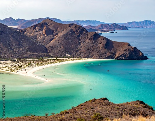 Wallpaper Mural Aerial view captures a serene beach with white sand, turquoise water, and rolling brown mountains under a bright sky Torontodigital.ca