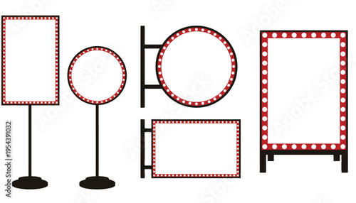 A set of blank marquee signs with red lights on stands