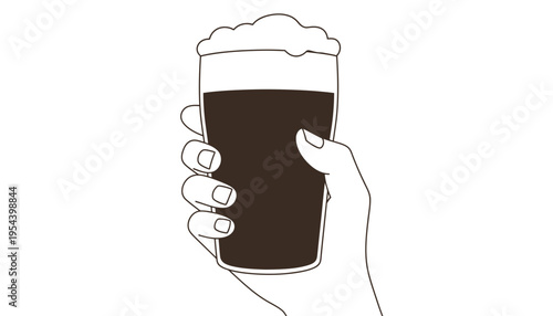 A hand holding a glass of dark beer with foam