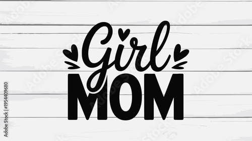 Stylized Girl Mom script with small heart accents against a light wooden plank surface