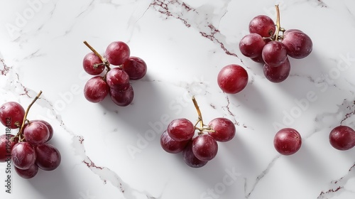 Fresh Red Grapes on Marble Surface, Juicy Fruits Arranged Elegantly, Perfect for Healthy Eating, Cooking, or Culinary Presentations, Stock Photo