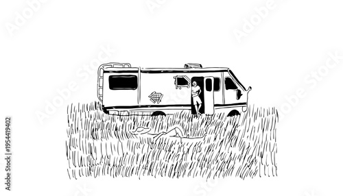 A camper van parked in a field with a person standing nearby