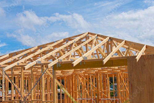 Wall and roof framing on a house construction in Australia. Property development Illustrating the concept of home building, the housing crisis, business and the economy during a recession.
