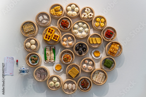 Fotografie Cantonese Dim Sum Assortment in Bamboo Steamers Overhead View