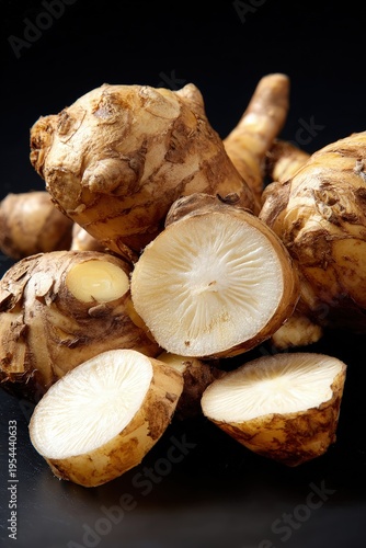 Closeup Fresh Ginger Roots On Dark Background