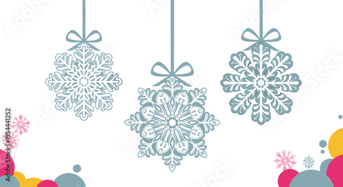 Three intricate white snowflake ornaments hanging from ribbons with colorful festive shapes in the corners for a merry holiday background.