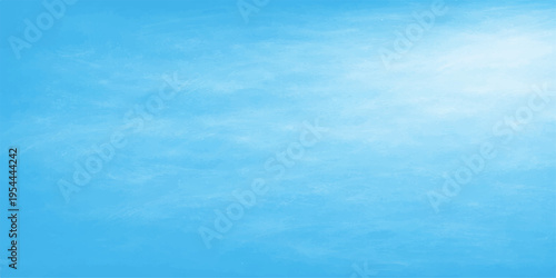 Abstract a tranquil view capturing the vast expanse of a clear, bright blue sky with a few wispy clouds. 