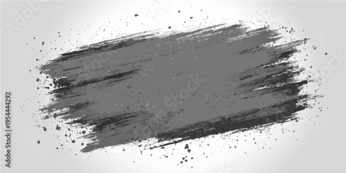 An abstract grunge style dark gray brush stroke creating a sense of raw art.