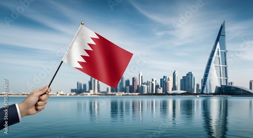 Bahrain flag waving in front of modern city skyline and waterfront