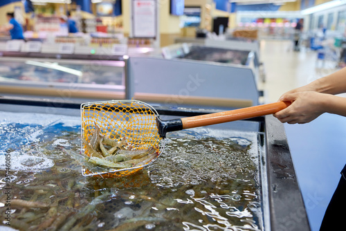 Fresh Shrimp Scooping at Seafood Market Counter