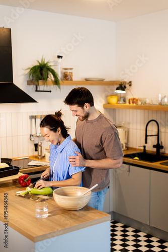 Couple cooking together in ...