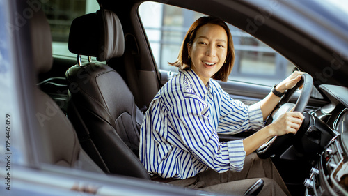 Korean woman driving a car ...