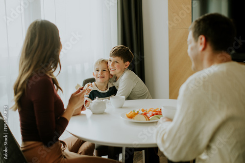 Family enjoys breakfast tog...