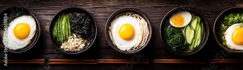 Assortment of prepared bowls featuring fried eggs and various fresh ingredients displayed in a row.