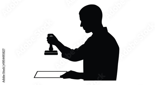 Man stamping a document viewed in profile a dark silhouette