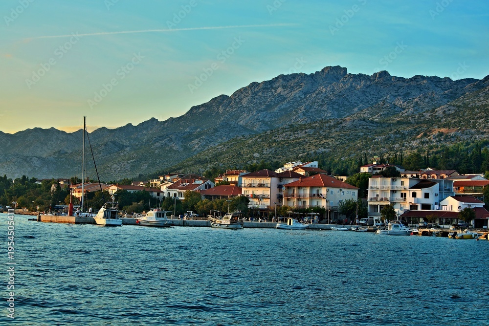 Obraz premium Croatia - view of a the harbor in town Starigrad at sunset