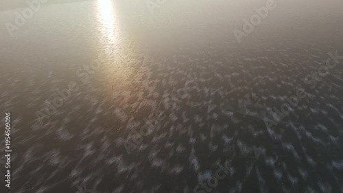 Morning over frozen lake, sunrise