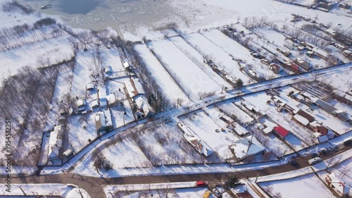 erial drone view of countryside village during snowstorm in Romania