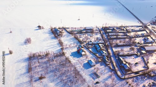 erial drone view of countryside village during snowstorm in Romania