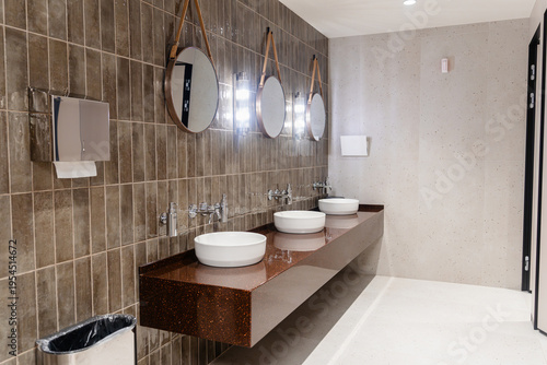 Public toilet with sinks and faucets