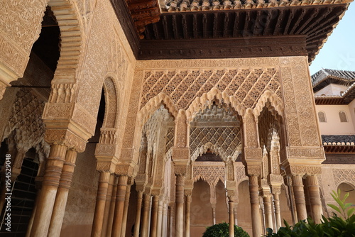 Fantastically decorated arches in the Lion Courtyard of the Alhambra, Granada, Andalusia, Spain 