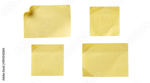 A collection of four vintage yellow sticky notes with crumpled edges, isolated on a transparent background.