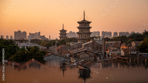 Quanzhou East-West Pagodas at Dusk, Old and New City Contrast