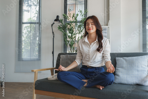 Woman meditating on sofa for mindfulness and inner peace Free Download Woman meditating on sofa for mindfulness and inner peace - GFXLoad
