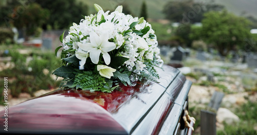 фотографія Coffin, flowers and funeral in graveyard with death, remembrance or burial ceremony for final goodbye